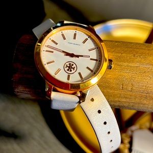 Tory Burch leather strap watch.